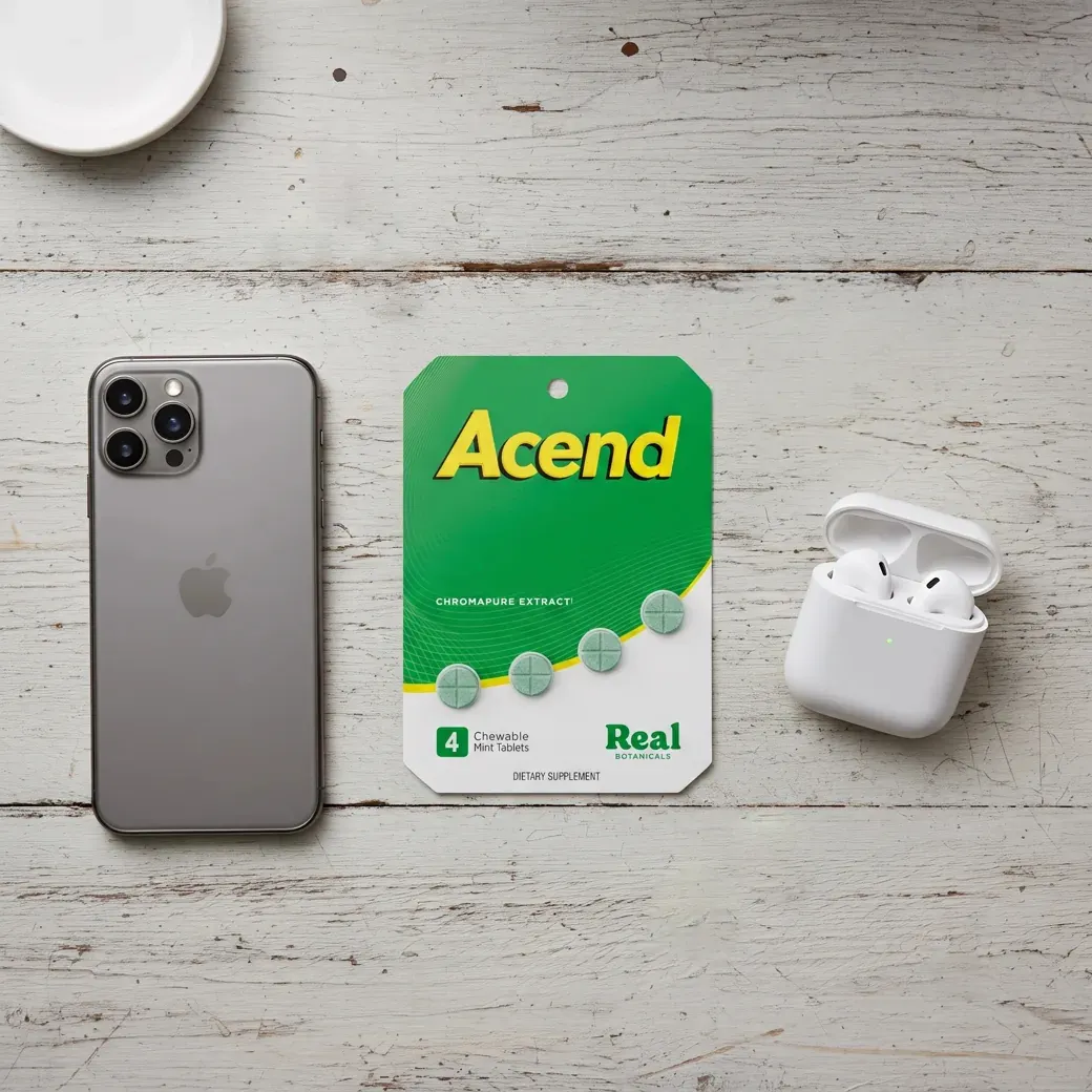 Acend chewable mint tablets on a table with phone and earbuds
